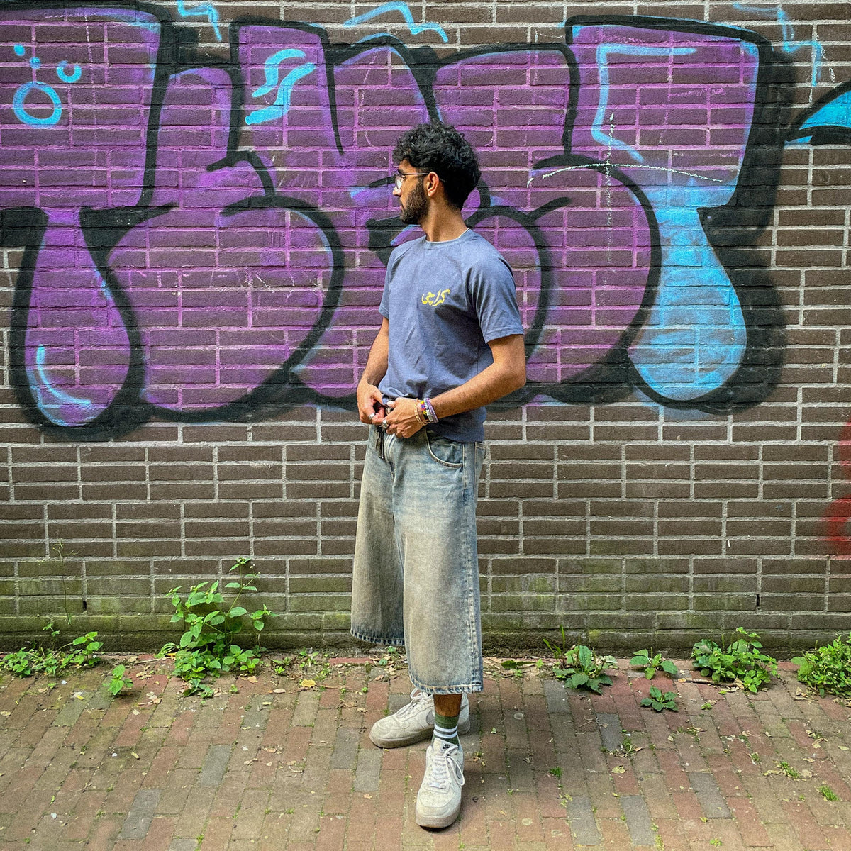 Khaar Studios OG Karachi Tee Midnight Indigo — detail shot of Urdu script print