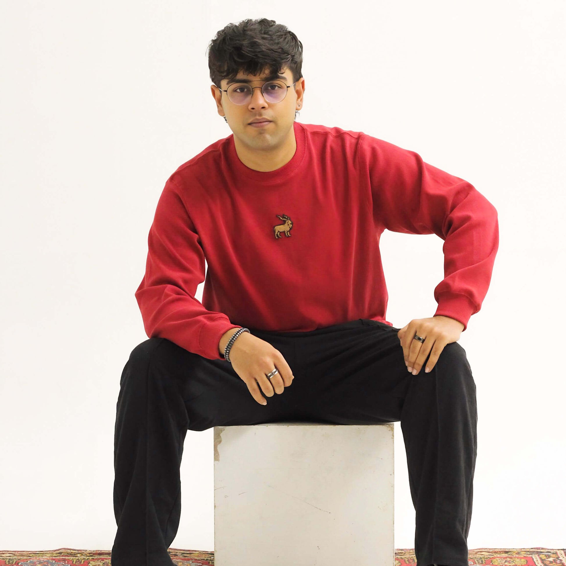 Khaar Markhor Knit Sweater in Maroon Red – Male Model Sitting