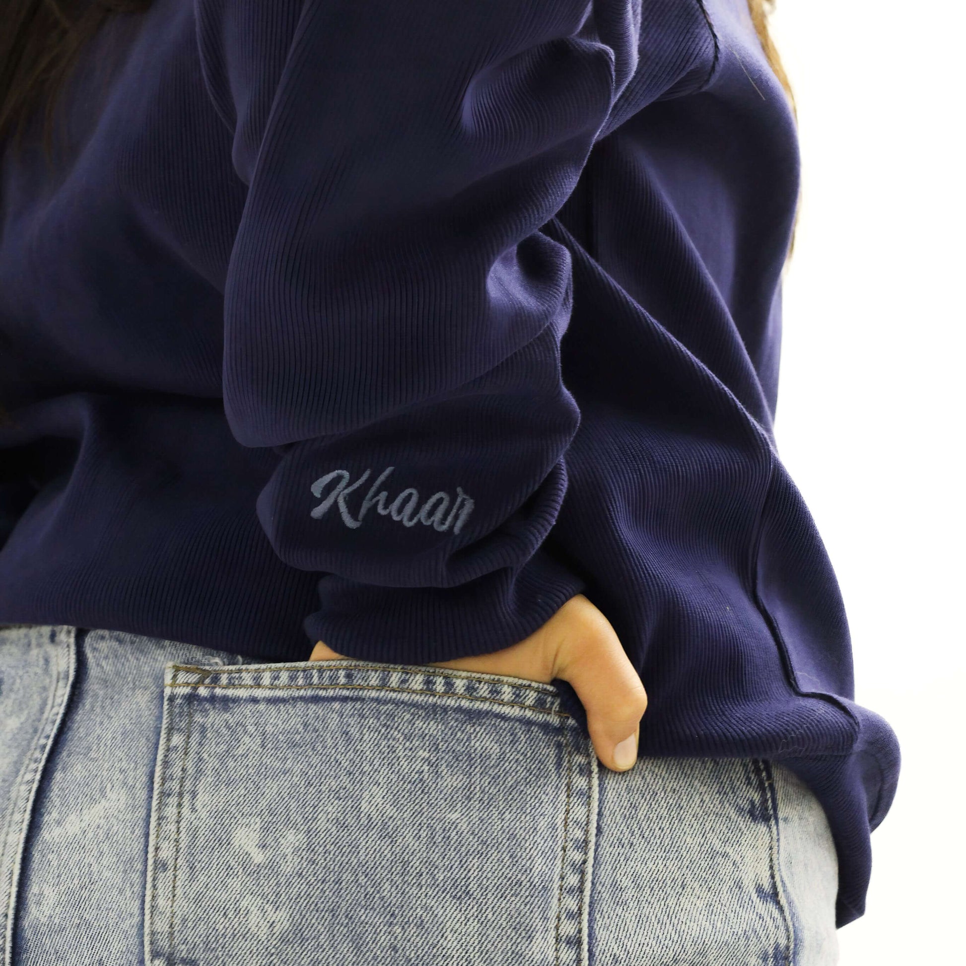 Khaar Markhor Knit Sweater in Navy Blue – Logo closeup