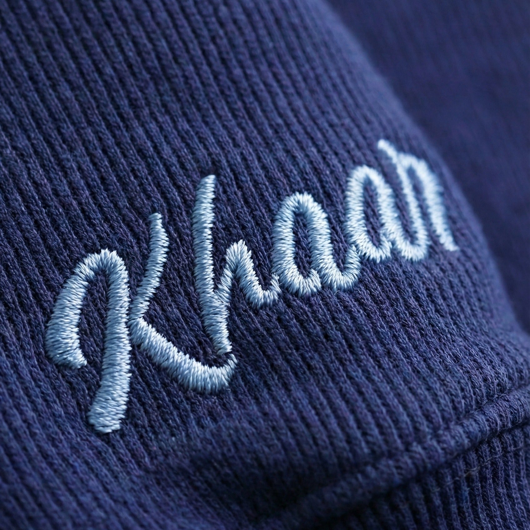 Khaar Markhor Knit Sweater in Navy Blue – Logo closeup