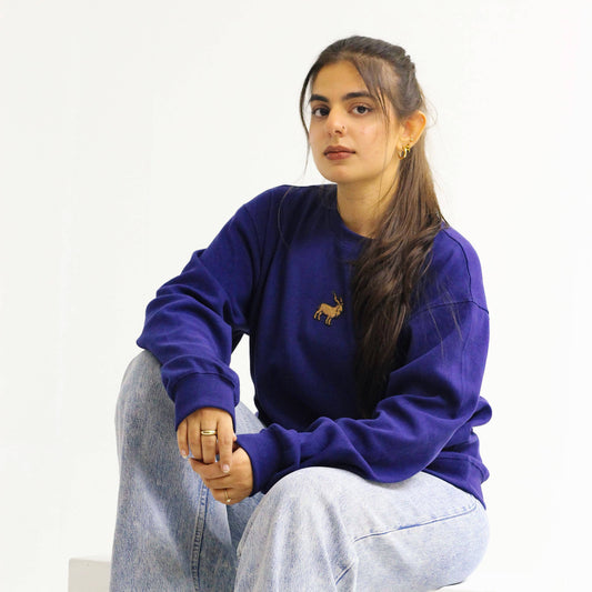 Khaar Markhor Knit Sweater in Navy Blue – Female Model sitting